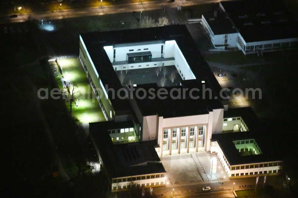 Aerial image at night Dresden - Night lighting Museum building ensemble Deutsches Hygiene-Museum in the street Lingnerplatz in Dresden in the state Saxony
