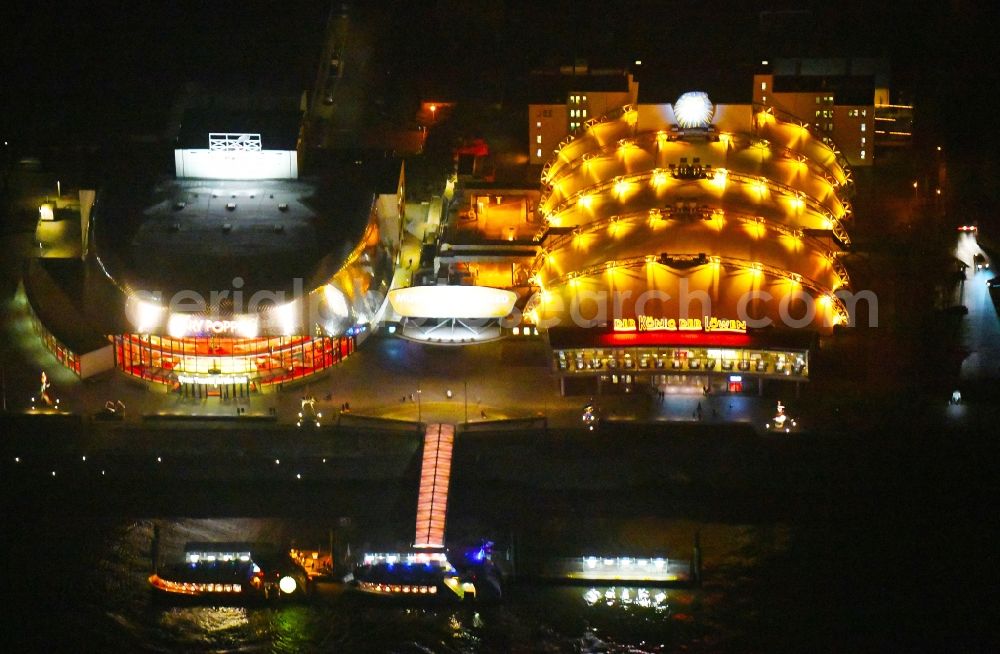 Aerial image at night Hamburg - Night lighting Musical Theatre, Stage entertainment on the banks of the Elbe in Hamburg Steinwerder
