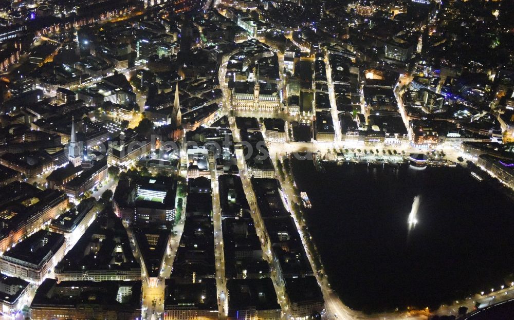 Hamburg at night from the bird perspective: Night view Riparian areas on the lake area of Binnenalster city center of Hamburg