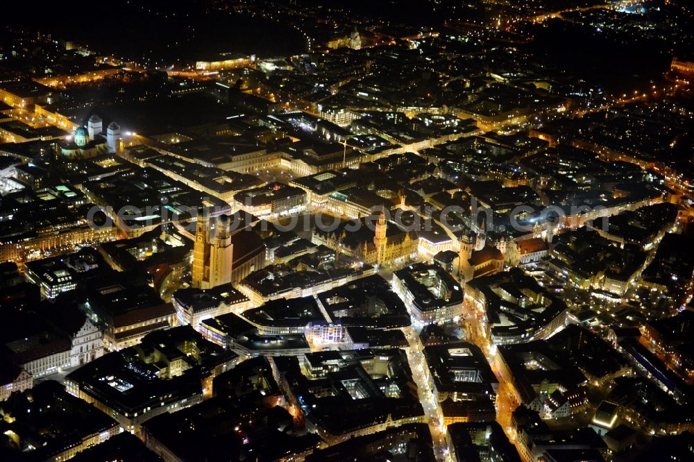 Aerial photograph at night München - City view of the Old Town at the Frauenkirche at the New Town Hall in the center of Munich in Bavaria