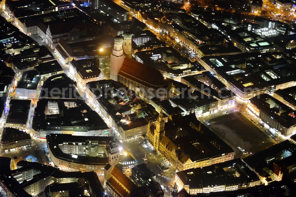 Aerial image at night München - City view of the Old Town at the Frauenkirche at the New Town Hall in the center of Munich in Bavaria
