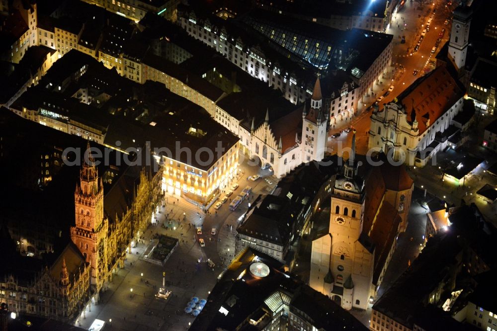 München at night from the bird perspective: City view of the Old Town at the Frauenkirche at the New Town Hall in the center of Munich in Bavaria