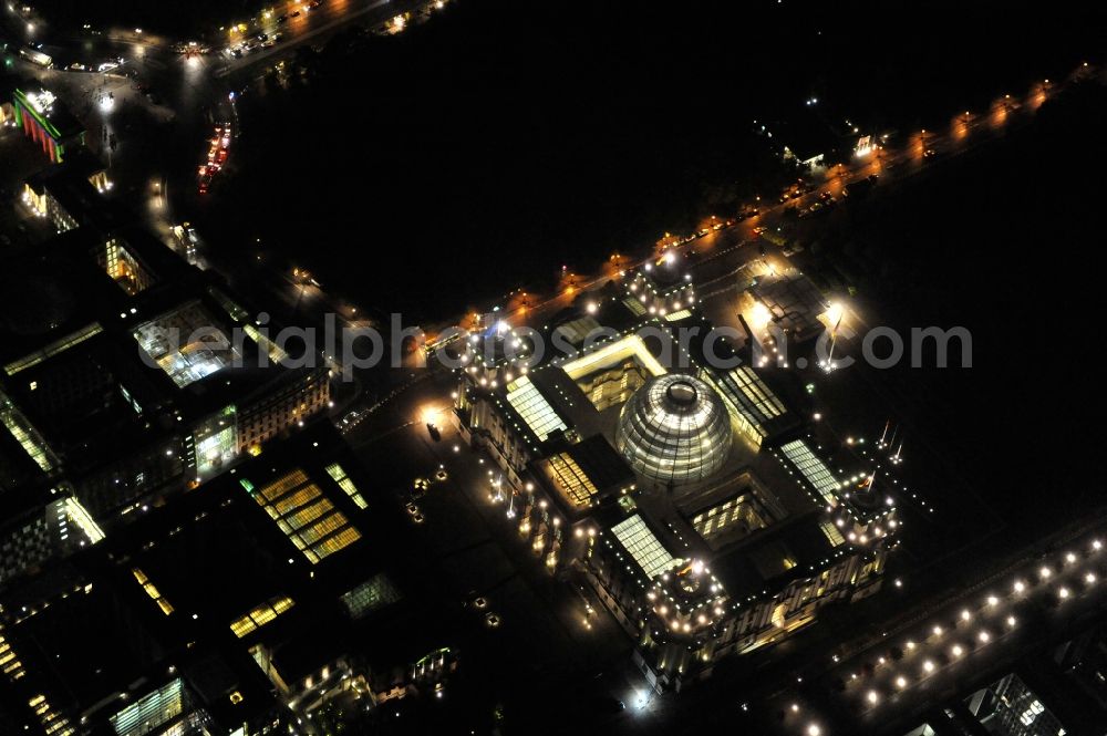 Berlin at night from the bird perspective: Night view at the Reichstag in the district Mitte in Berlin. The Reichstag is the domicile of the german federal parliament