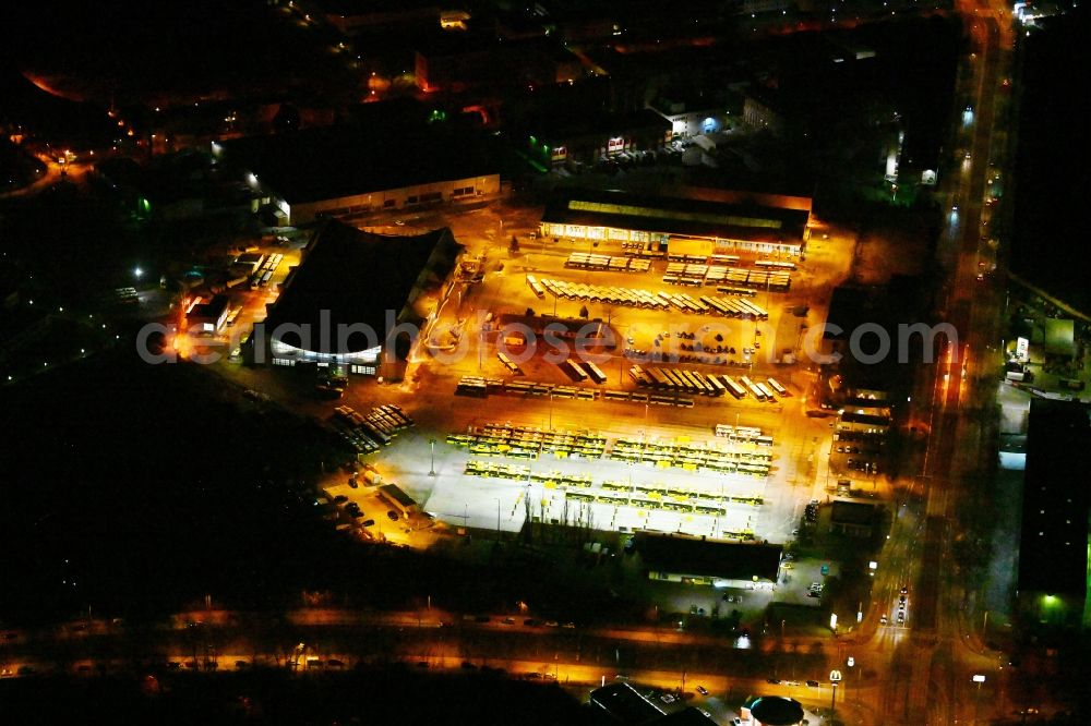 Berlin at night from the bird perspective: Night lighting depot of the Municipal Transport Company on Indira-Gandhi-Strasse in the district Hohenschoenhausen in Berlin, Germany