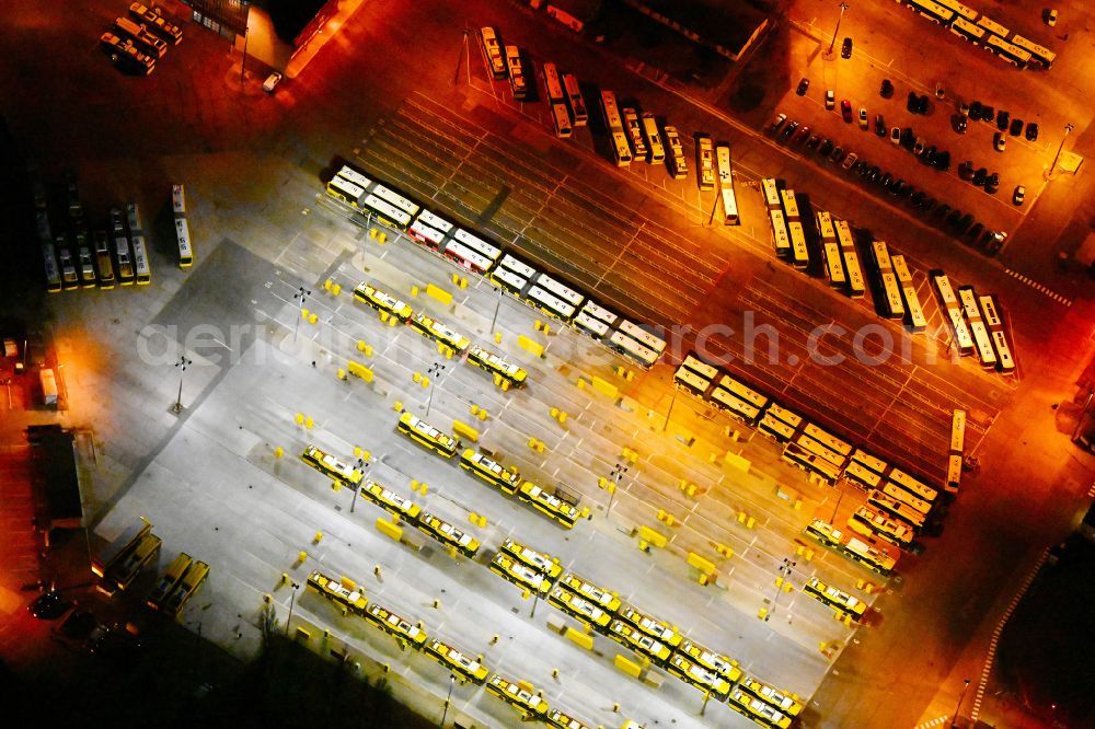 Aerial photograph at night Berlin - Night lighting depot of the Municipal Transport Company on Indira-Gandhi-Strasse in the district Hohenschoenhausen in Berlin, Germany