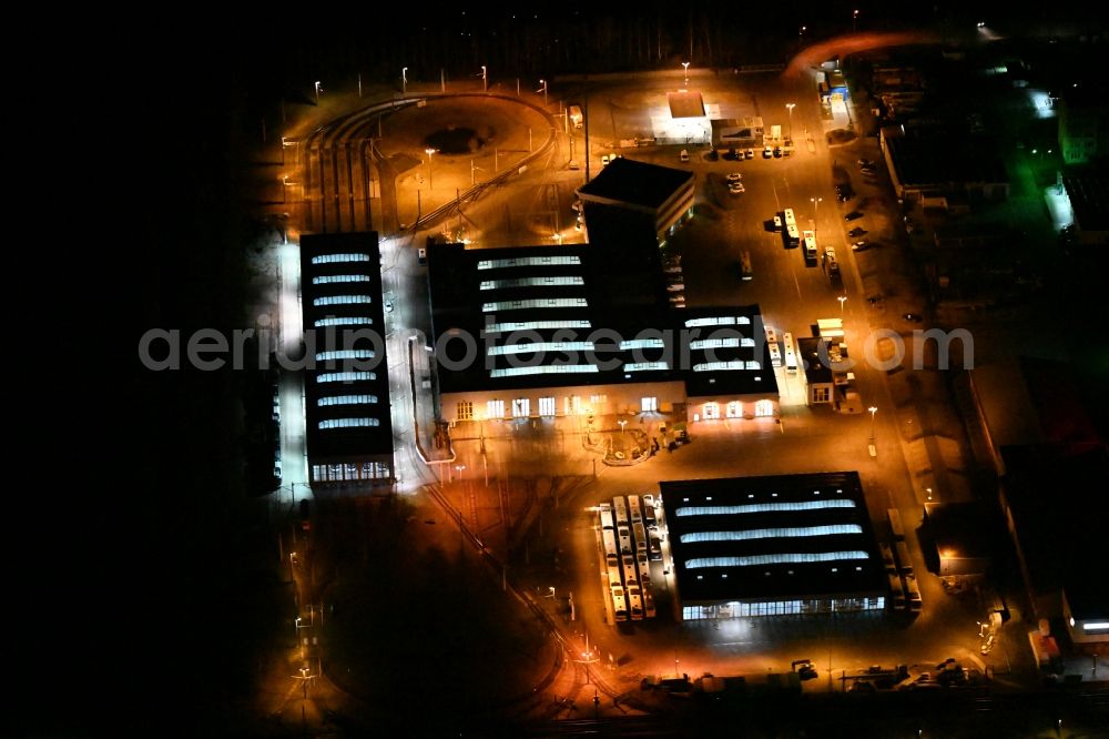 Jena at night from the bird perspective: Night lighting tram depot of the Municipal Transport Company Jenaer Nahverkehr GmbH in Jena in the state Thuringia, Germany