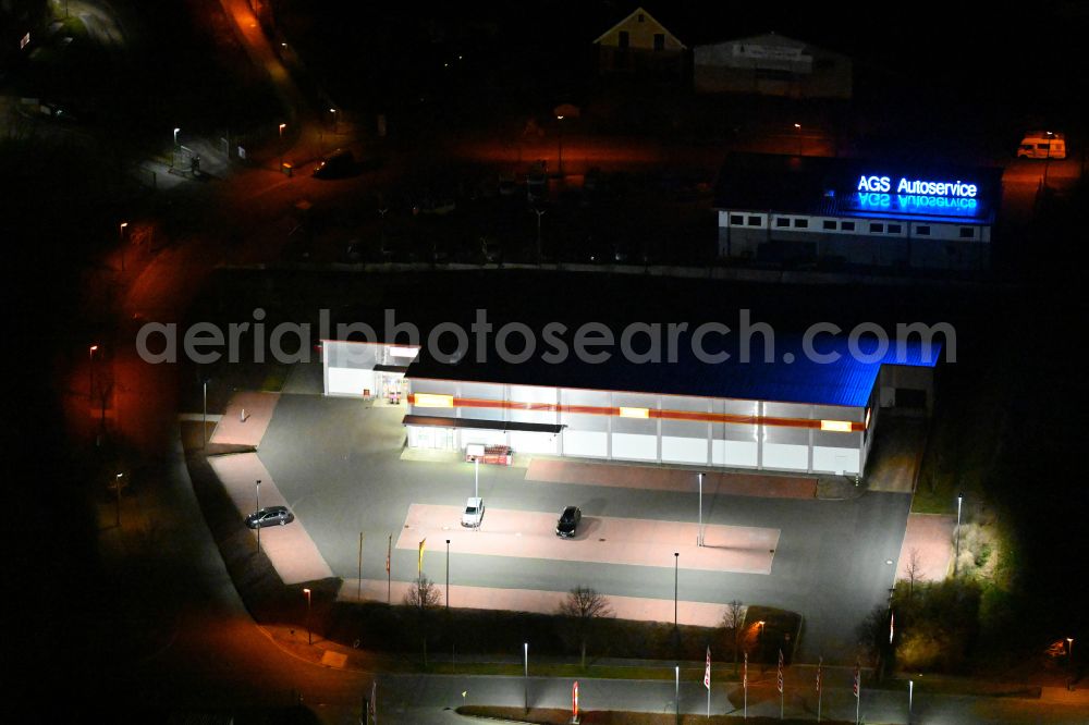 Bürgel at night from above - Night lighting building complex of local supply center on street In den Satteln in Buergel in the state Thuringia, Germany