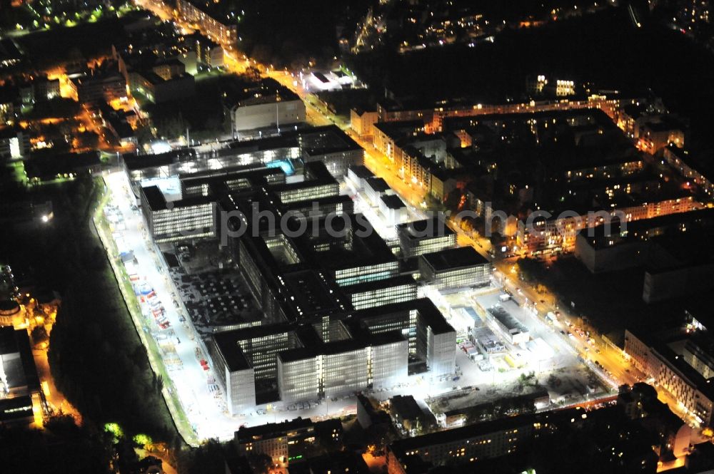 Aerial image at night Berlin - Night lighting Construction of BND headquarters on Chausseestrasse in the Mitte district of the capital Berlin. The Federal Intelligence Service (BND) built according to plans by the Berlin architectural firm Kleihues offices in the capital its new headquarters