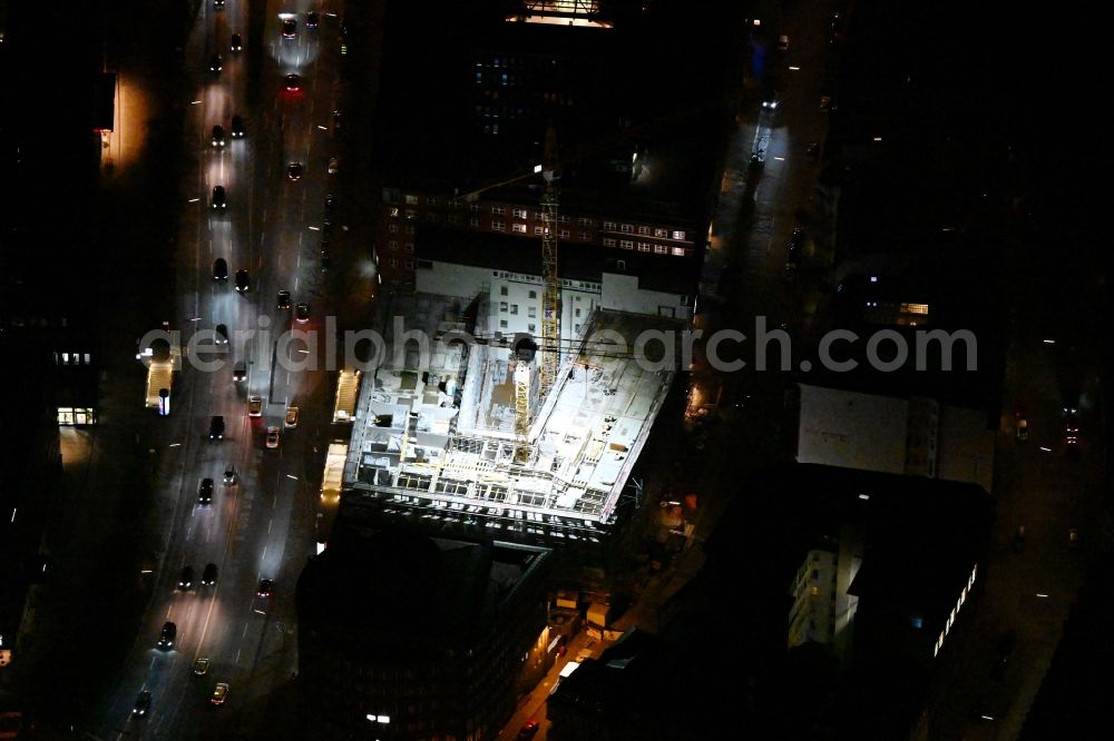 Hamburg at night from the bird perspective: Night lighting construction site to build a new office and commercial building EDGE ElbSide on place Amerigo-Vespucci-Platz in the district HafenCity in Hamburg, Germany