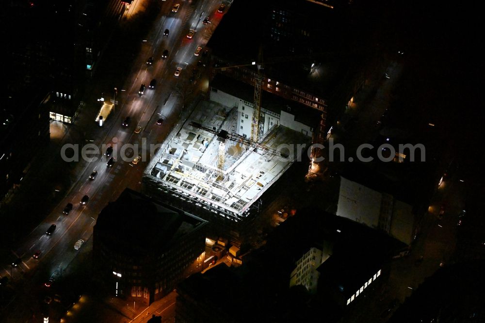 Aerial photograph at night Hamburg - Night lighting construction site to build a new office and commercial building EDGE ElbSide on place Amerigo-Vespucci-Platz in the district HafenCity in Hamburg, Germany