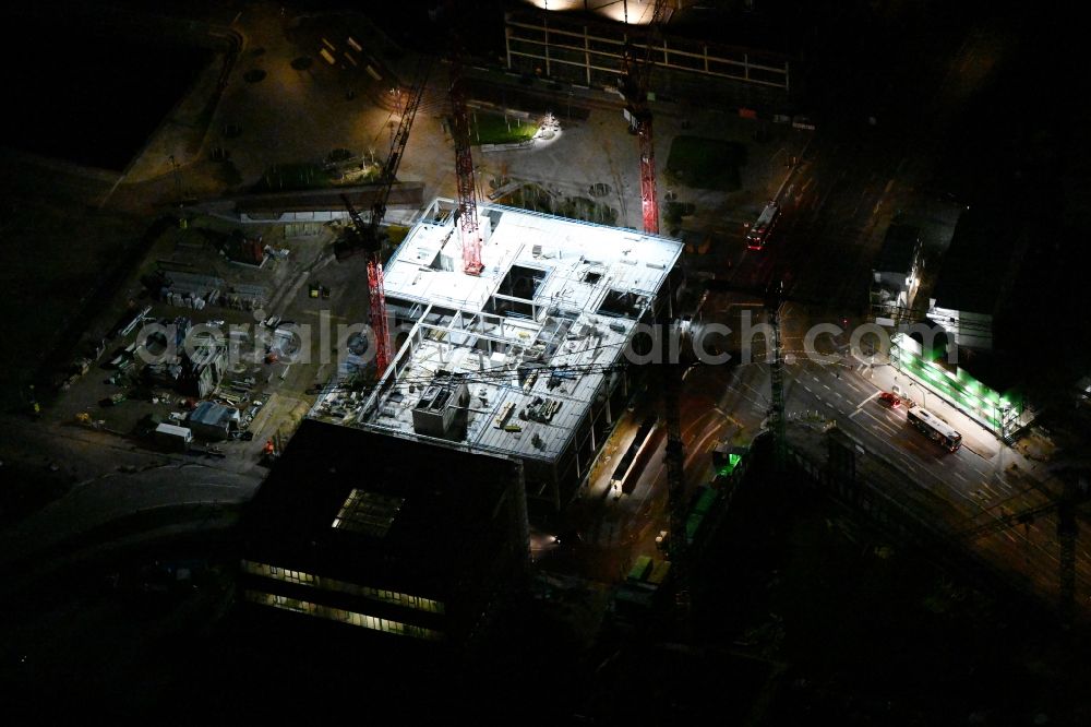 Hamburg at night from above - Night lighting construction site to build a new office and commercial building EDGE ElbSide on place Amerigo-Vespucci-Platz in the district HafenCity in Hamburg, Germany