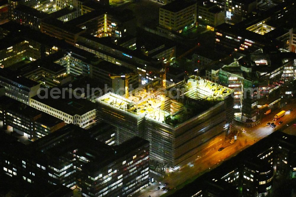Aerial image at night Hamburg - Night lighting construction site to build a new office and commercial building of Olympus Campus on Heidenkonpsweg - Wendenstrasse in Hamburg, Germany