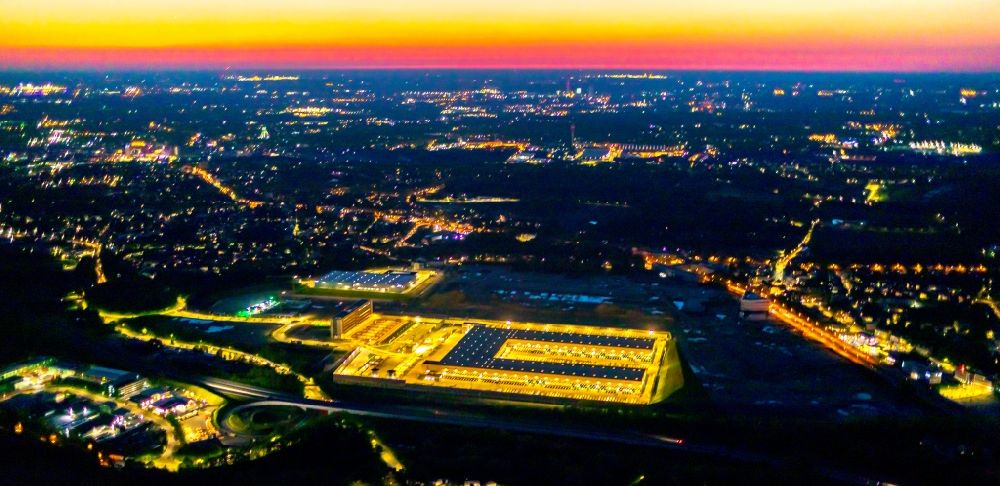 Bochum at night from the bird perspective: Night lighting new building complex of DHL parcel and logistics center in the development area MARK 51A7 in Bochum in the state North Rhine-Westphalia, Germany