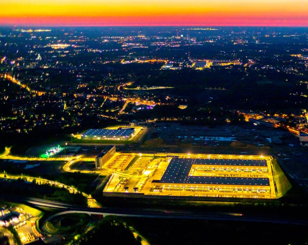 Aerial photograph at night Bochum - Night lighting new building complex of DHL parcel and logistics center in the development area MARK 51A7 in Bochum in the state North Rhine-Westphalia, Germany