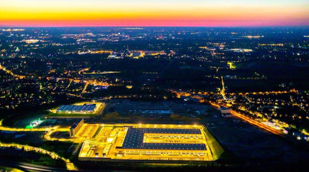 Bochum at night from above - Night lighting new building complex of DHL parcel and logistics center in the development area MARK 51A7 in Bochum in the state North Rhine-Westphalia, Germany