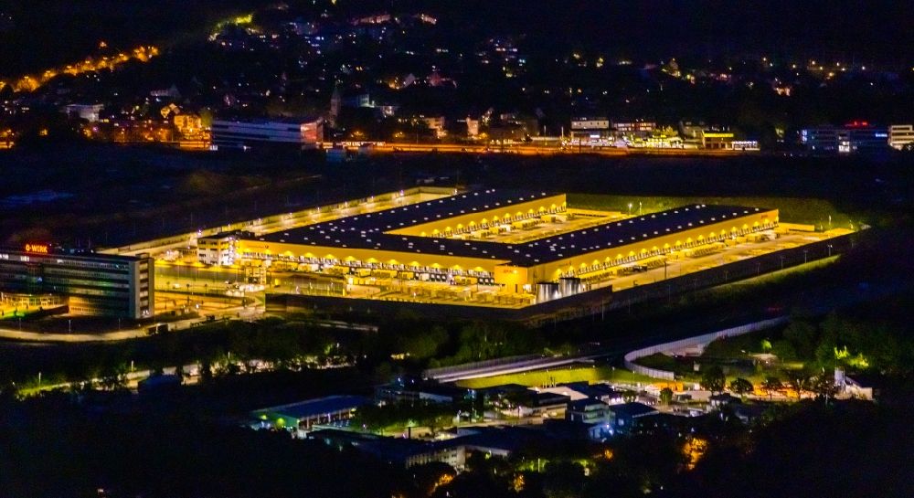 Aerial image at night Bochum - Night lighting new building complex of DHL parcel and logistics center in the development area MARK 51A7 in Bochum at Ruhrgebiet in the state North Rhine-Westphalia, Germany