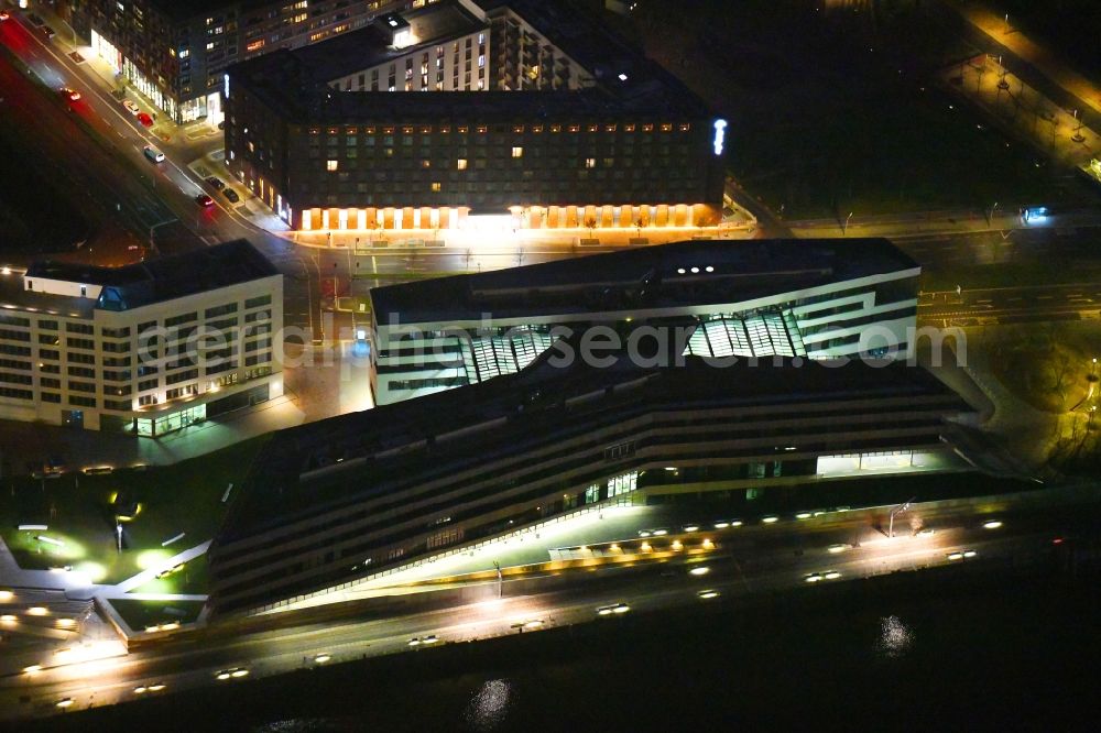 Hamburg at night from the bird perspective: Night lighting view of building lot of the new Hafen city University in Hamburg