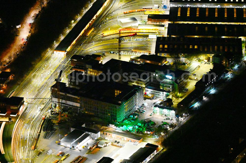 Berlin at night from above - Night lighting railway depot and repair shop for maintenance and repair of trains the Berlin subway in the district Charlottenburg Westend in Berlin, Germany