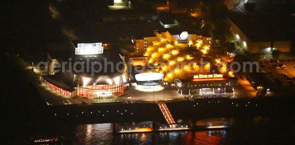Aerial photograph at night Hamburg - Night lighting Building of the new Musical Theatre, Stage entertainment on the banks of the Elbe in Hamburg Steinwerder