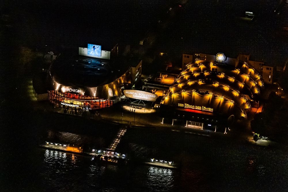 Hamburg at night from above - Night lighting Building of the new Musical Theatre, Stage entertainment on the banks of the Elbe in the district Steinwerder in Hamburg Steinwerder