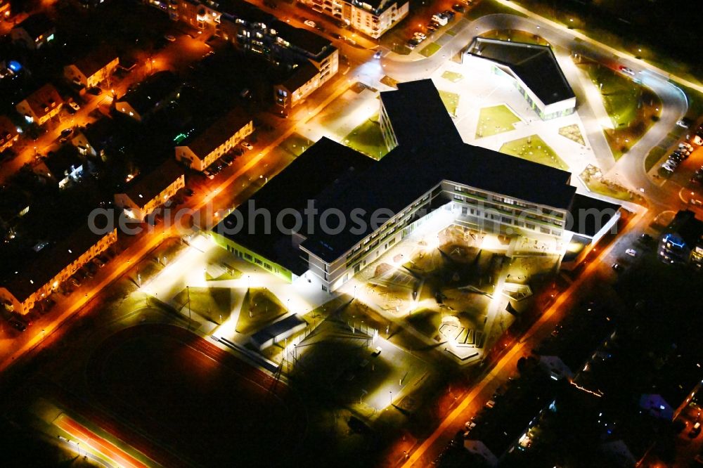 Hönow at night from above - Night lighting building city destrict center between of Schulstrasse and of Marderstrasse in Hoenow in the state Brandenburg, Germany