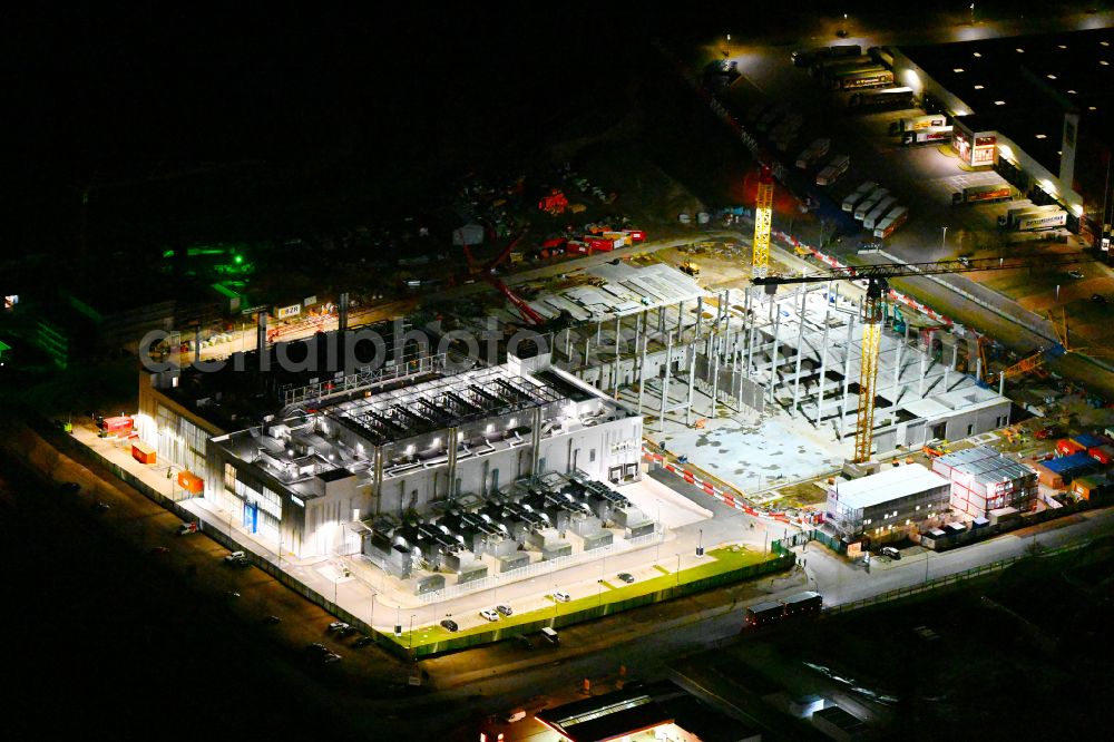 Mittenwalde at night from above - Night lighting construction site of data center building and online data processing hub on street Dahmestrasse in Mittenwalde in the state Brandenburg, Germany