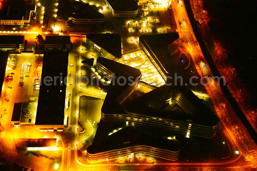 Köln at night from the bird perspective: Night lighting administration building of the company RheinEnergie AG on Parkguertel in the district Ehrenfeld in Cologne in the state North Rhine-Westphalia, Germany