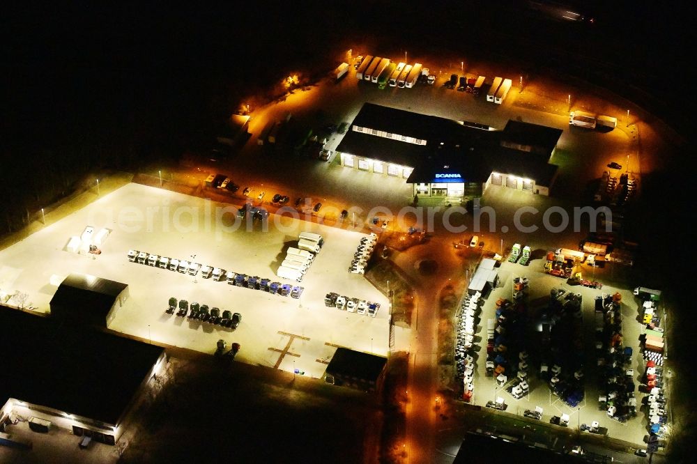Aerial image at night Ludwigsfelde - Night lighting commercial Vehicle and Special Vehicle trade on Kastanienweg in Ludwigsfelde in the state Brandenburg, Germany