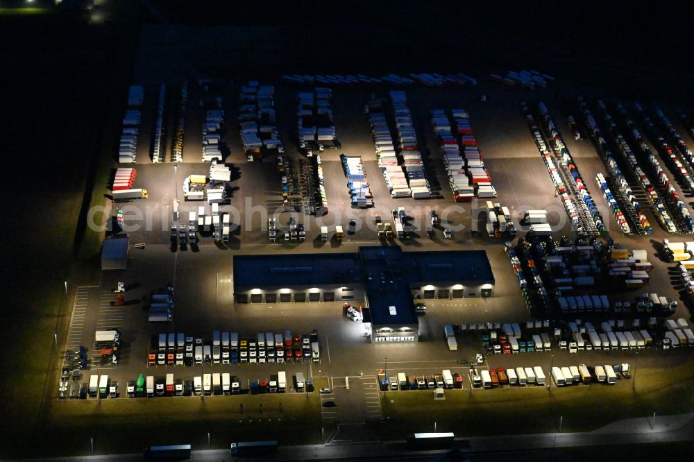 Ichtershausen at night from above - Night lighting commercial Vehicle and Special Vehicle trade TruckStore Erfurt on street Auf dem Obergewende in Ichtershausen in the state Thuringia, Germany