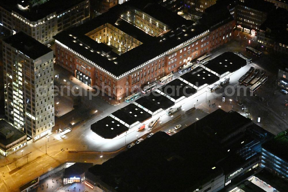 Hamburg at night from above - Night lighting bus station for public transportation overlooking the campus universitys building of the University of Applied Sciences Europe on Museumstrasse - Paul-Nevermann-Platz in Hamburg, Germany
