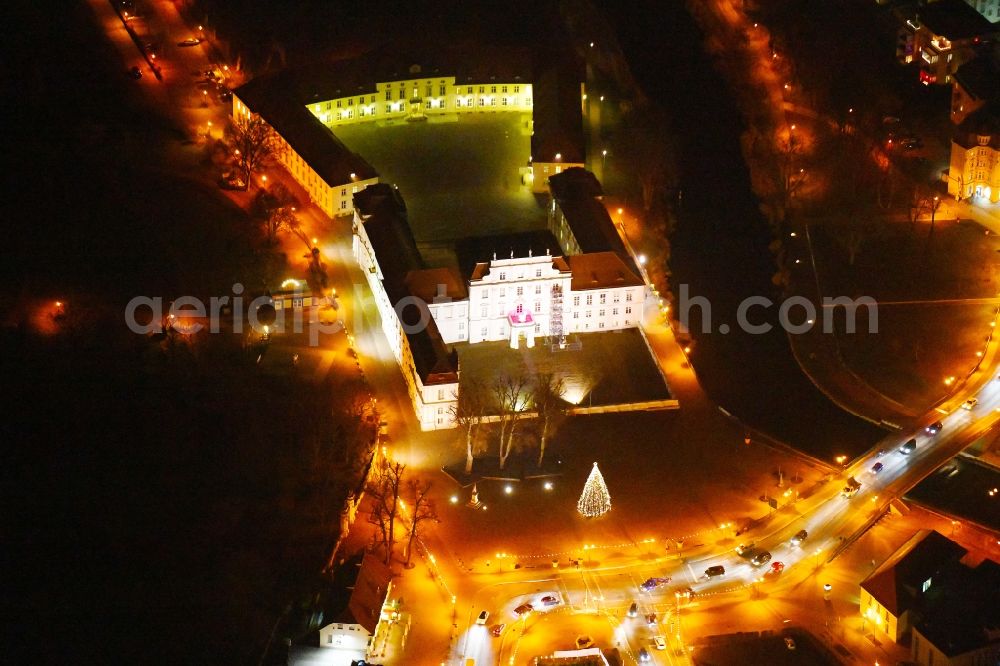 Aerial image at night Oranienburg - Night lighting Palace am Schlossplatz in Oranienburg in the state Brandenburg