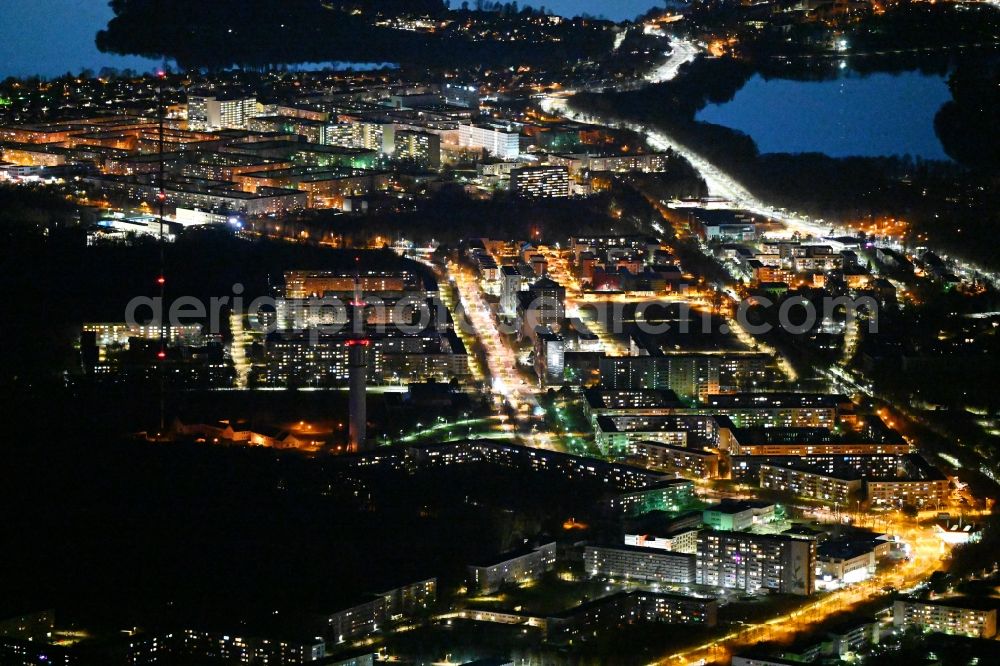 Aerial photograph at night Schwerin - Night lighting skyscrapers in the residential area of industrially manufactured settlement Grosser Dreesch in the district Zippendorf in Schwerin in the state Mecklenburg - Western Pomerania, Germany
