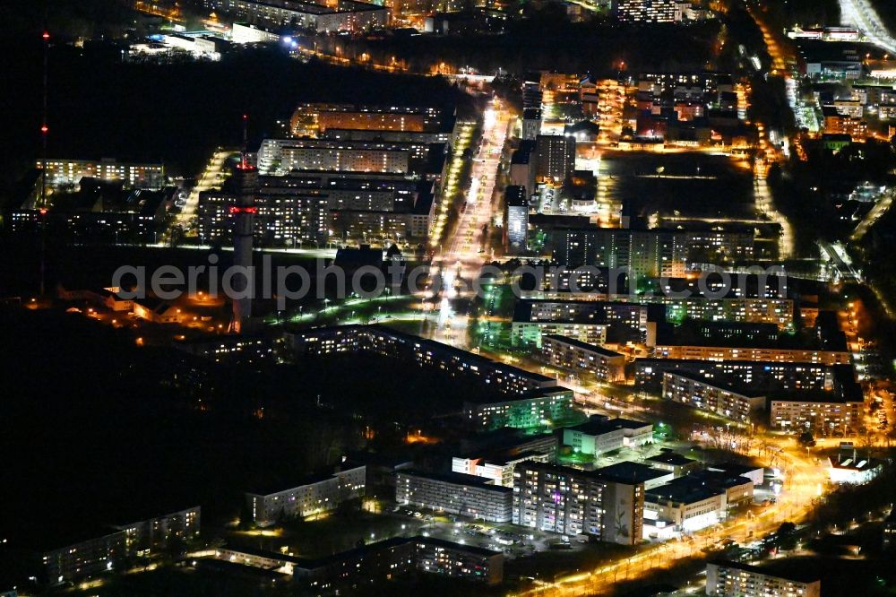 Aerial image at night Schwerin - Night lighting skyscrapers in the residential area of industrially manufactured settlement Grosser Dreesch in the district Zippendorf in Schwerin in the state Mecklenburg - Western Pomerania, Germany