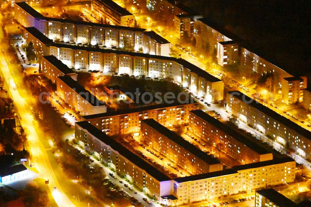 Wernigerode at night from the bird perspective: Night lighting skyscrapers in the residential area of industrially manufactured settlement Am Kastanienwaeldchen in Wernigerode in the state Saxony-Anhalt, Germany