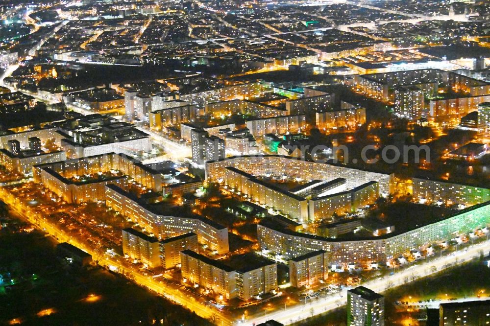 Aerial photograph at night Berlin - Night lighting skyscrapers in the residential area of industrially manufactured settlement on Fennpfuhl in the district Lichtenberg in Berlin, Germany