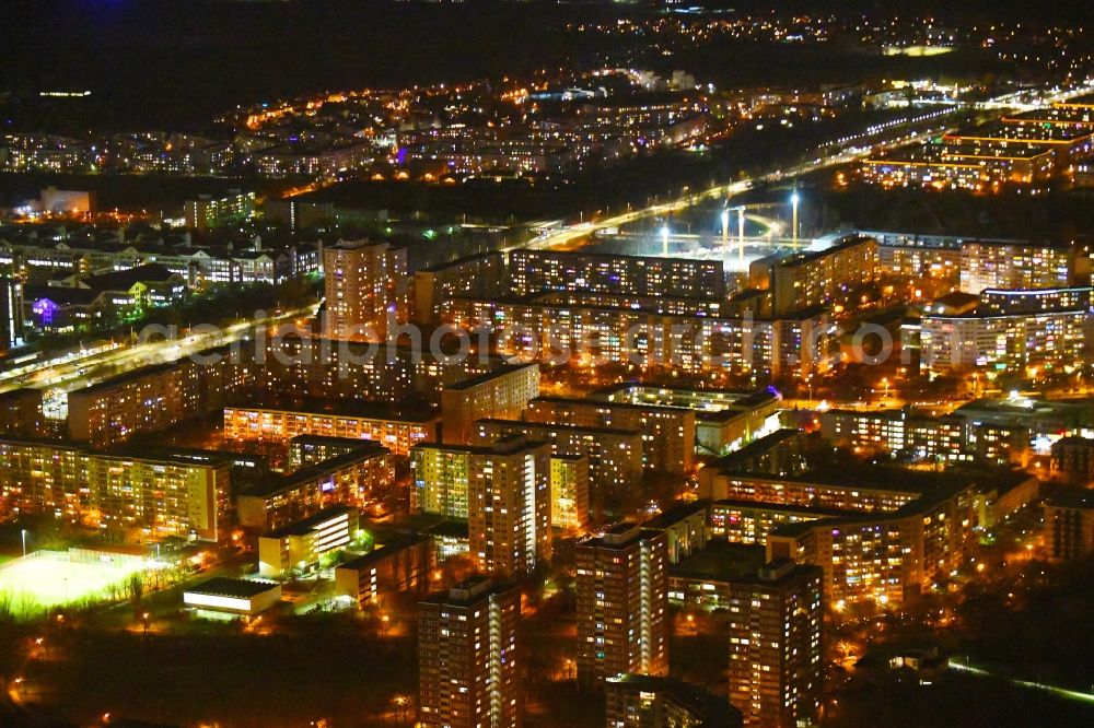 Aerial photograph at night Berlin - Night lighting skyscrapers in the residential area of industrially manufactured settlement along the Mehrower Allee in the district Marzahn in Berlin, Germany