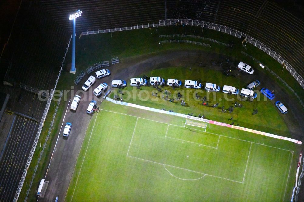 Aerial photograph at night Leipzig - Night lighting Police trainingmission in the Football stadium Bruno-Plache-Stadion on Connewitzer Strasse in the district Suedost in Leipzig in the state Saxony, Germany