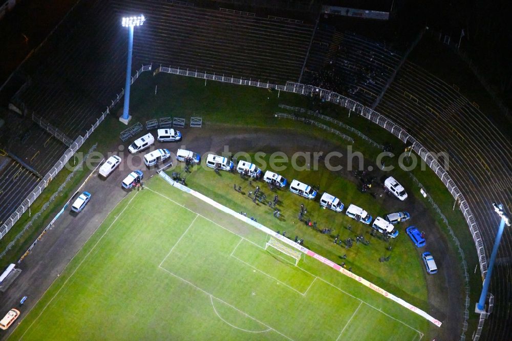 Aerial image at night Leipzig - Night lighting Police trainingmission in the Football stadium Bruno-Plache-Stadion on Connewitzer Strasse in the district Suedost in Leipzig in the state Saxony, Germany