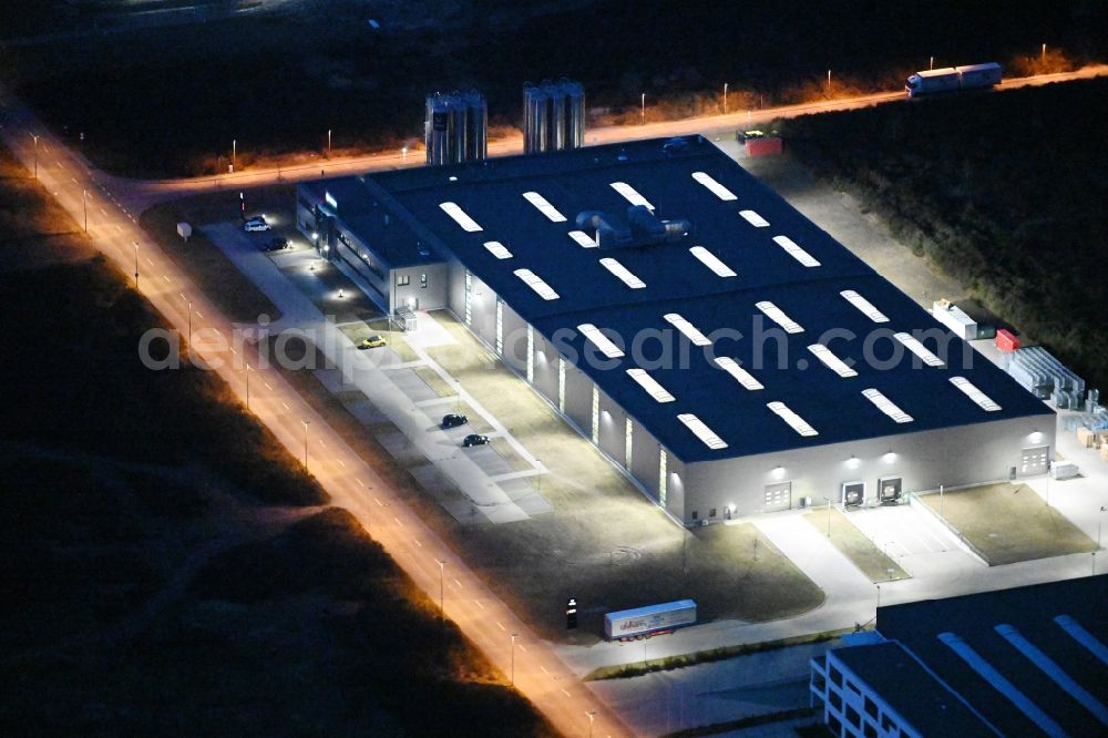 Aerial photograph at night Schwerin - Night lighting production site of Procap in the Industrial Park Schwerin on street Ludwig-Boelkow-Strasse in Schwerin in the state of Mecklenburg - Western Pomerania