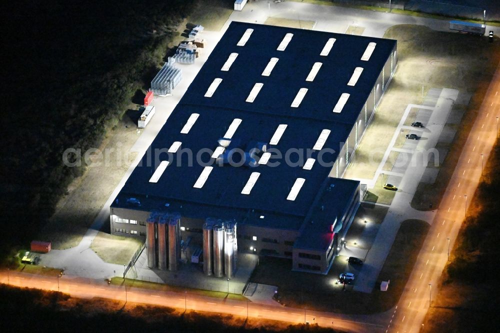 Aerial image at night Schwerin - Night lighting production site of Procap in the Industrial Park Schwerin on street Ludwig-Boelkow-Strasse in Schwerin in the state of Mecklenburg - Western Pomerania
