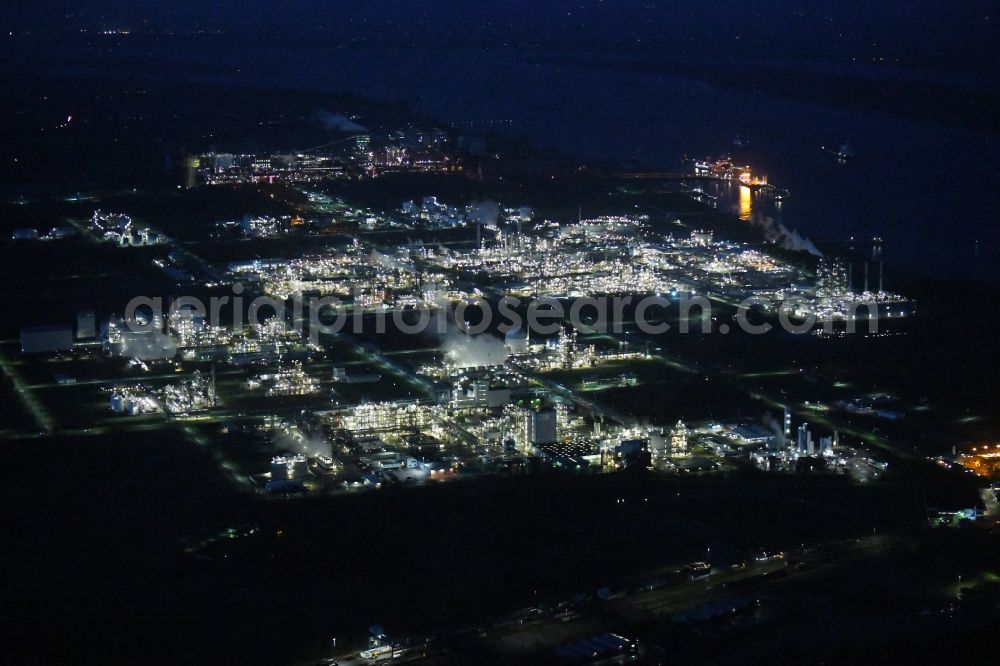 Stade at night from the bird perspective: Night lighting refinery equipment and management systems on the factory premises of the chemical manufacturers of Fa. Dow Chemical Olin in Stade in the state Lower Saxony, Germany