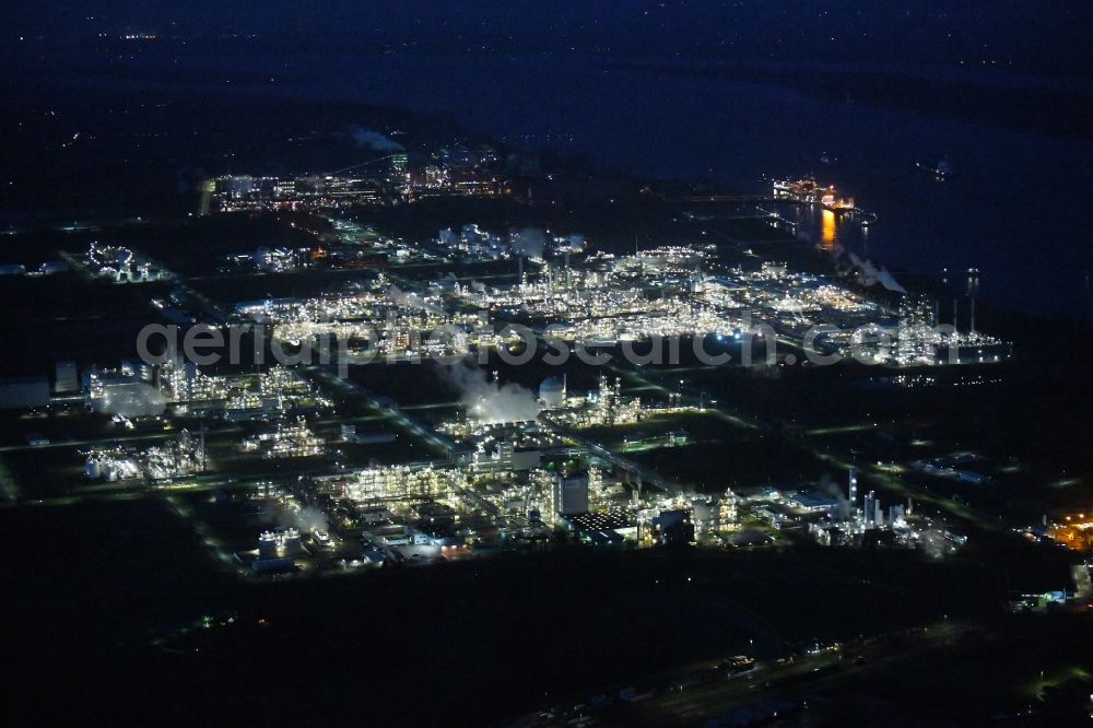 Aerial image at night Stade - Night lighting refinery equipment and management systems on the factory premises of the chemical manufacturers of Fa. Dow Chemical Olin in Stade in the state Lower Saxony, Germany