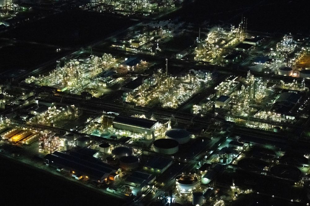 Stade at night from above - Night lighting refinery equipment and management systems on the factory premises of the chemical manufacturers of Fa. Dow Chemical Olin in Stade in the state Lower Saxony, Germany