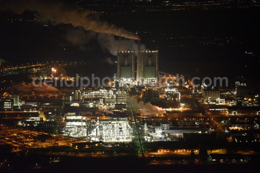 Aerial image at night Schkopau - Night view of Refinery equipment and management systems on the factory premises of the chemical manufacturers Dow Olefinverbund GmbH in Schkopau in the state Saxony-Anhalt