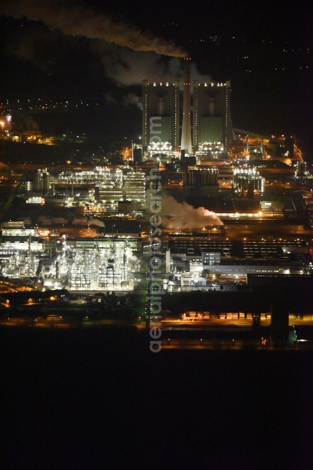 Schkopau at night from above - Night view of Refinery equipment and management systems on the factory premises of the chemical manufacturers Dow Olefinverbund GmbH in Schkopau in the state Saxony-Anhalt