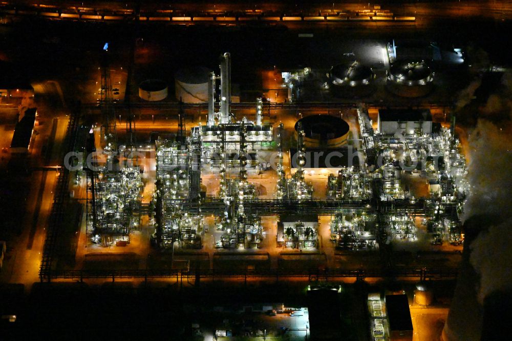 Aerial photograph at night Leuna - Night lighting refinery equipment and management systems on the factory premises of the chemical manufacturers on street Strasse der OdF in the district Spergau in Leuna in the state Saxony-Anhalt, Germany