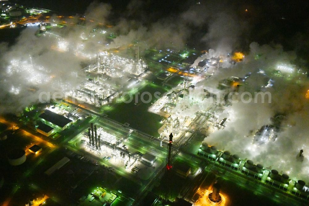Aerial photograph at night Lippendorf - Night lighting Refinery equipment and management systems on the factory premises of the mineral oil manufacturers in Lippendorf in the state Saxony, Germany