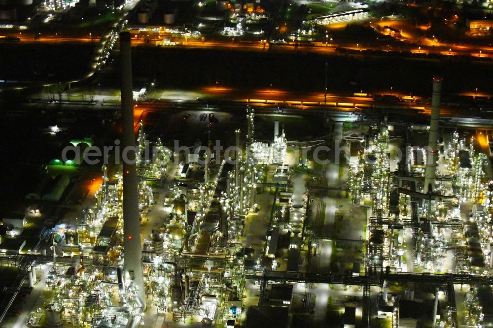Karlsruhe at night from the bird perspective: Night lighting refinery equipment and management systems on the factory premises of the mineral oil manufacturers Mineraloelraffinerie Oberrhein in the district Knielingen in Karlsruhe in the state Baden-Wurttemberg, Germany