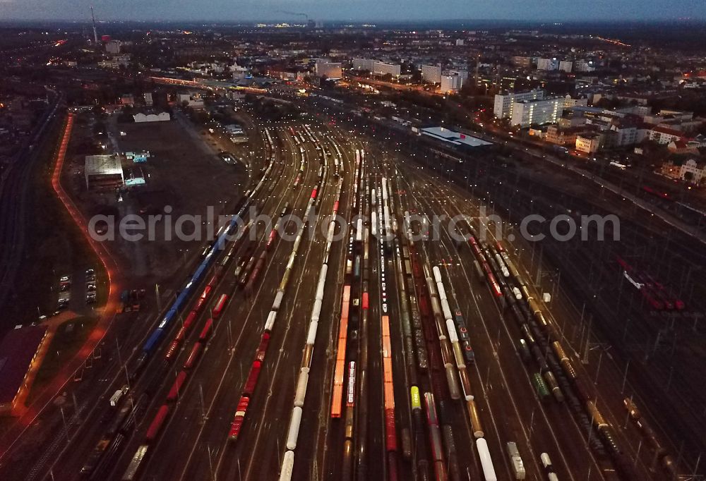 Aerial image at night Halle (Saale) - Night lighting marshalling yard and freight station of the Deutsche Bahn in Halle (Saale) in the state Saxony-Anhalt, Germany