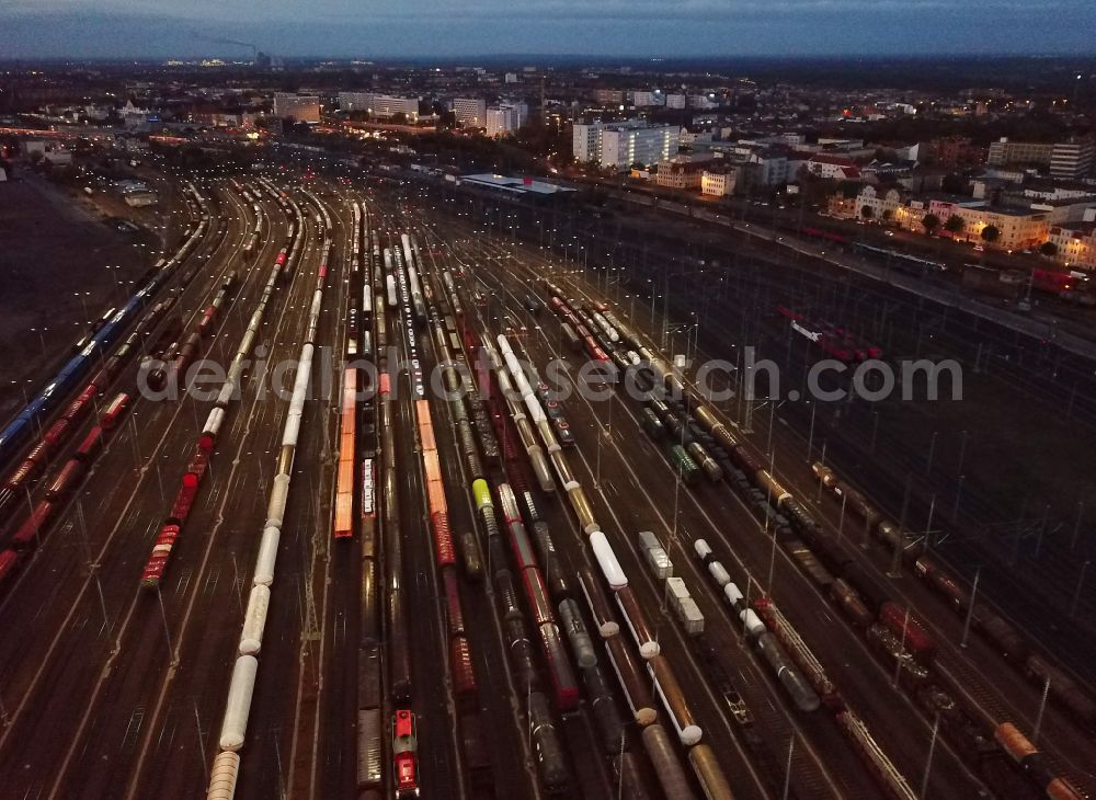 Aerial photograph at night Halle (Saale) - Night lighting marshalling yard and freight station of the Deutsche Bahn in Halle (Saale) in the state Saxony-Anhalt, Germany